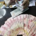 Rupiah Tertekan terhadap Dolar AS Akibat Tarif Impor Trump Hari Ini