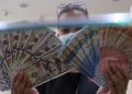 Rupiah Menguat ke 18.015 per Dolar AS, Sentimen Domestik Jadi Penopang