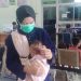Tangis Sedih Bayi Aisya Berebut Udara Segar di Tengah Asap Pekat Palembang